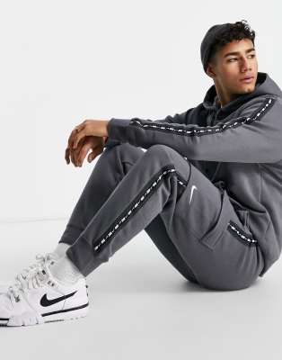 Nike Repeat Pack logo taped cargo joggers in iron grey