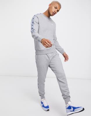 nike repeat pack logo taping tracksuit set in grey