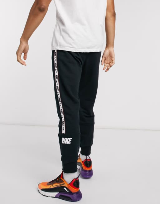 Nike Repeat Pack logo taping cuffed joggers in black ASOS