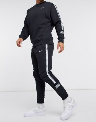 nike contrast stripe cuffed joggers in black