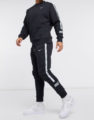 nike logo taping cuffed joggers in black