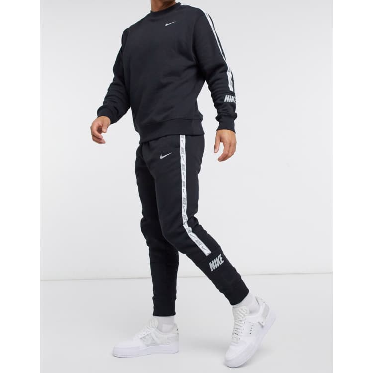 Nike Repeat Pack logo taping cuffed joggers in black