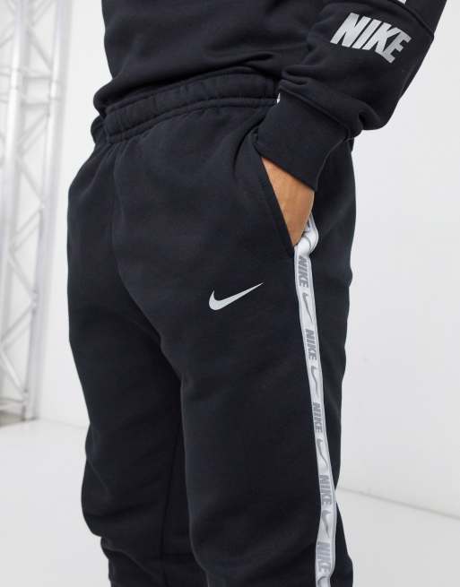 Nike gel tape cuffed track hot sale pants black