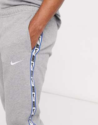 nike repeat tape tracksuit grey