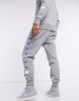 Nike repeat pack logo taping cuffed joggers in grey sale