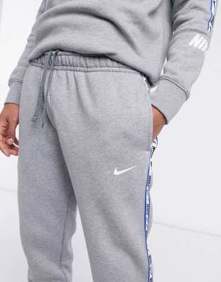 nike logo taping cuffed joggers in grey