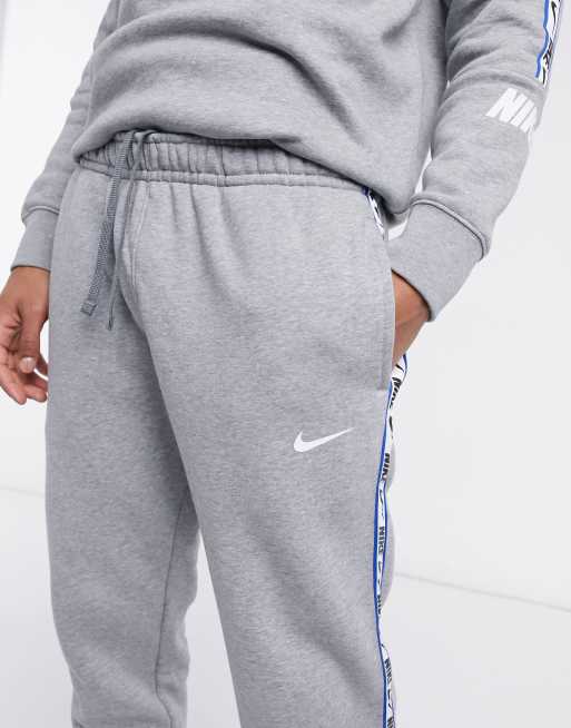 Nike repeat pack logo discount taping cuffed joggers in khaki