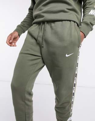 nike repeat pack logo taping cuffed joggers in khaki