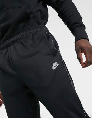 nike logo taping cuffed joggers in black