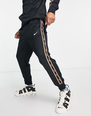 Nike repeat pack poly knit joggers in black and gold - ASOS Price Checker