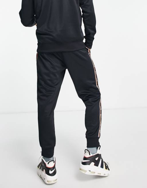 Nike tape 2025 poly joggers men