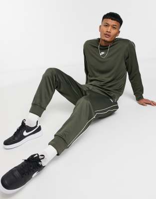 nike logo taping cuffed joggers in grey