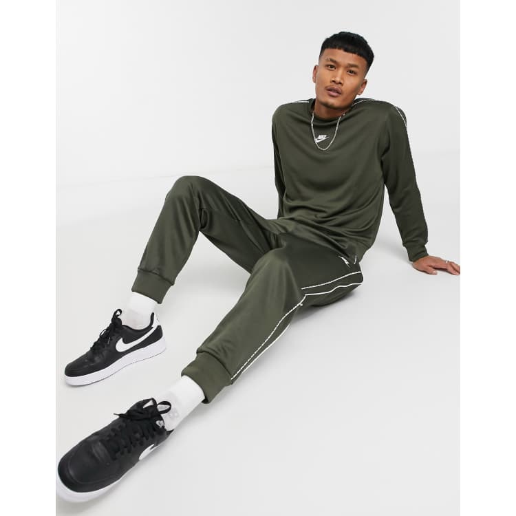 Nike logo taping online cuffed joggers in grey