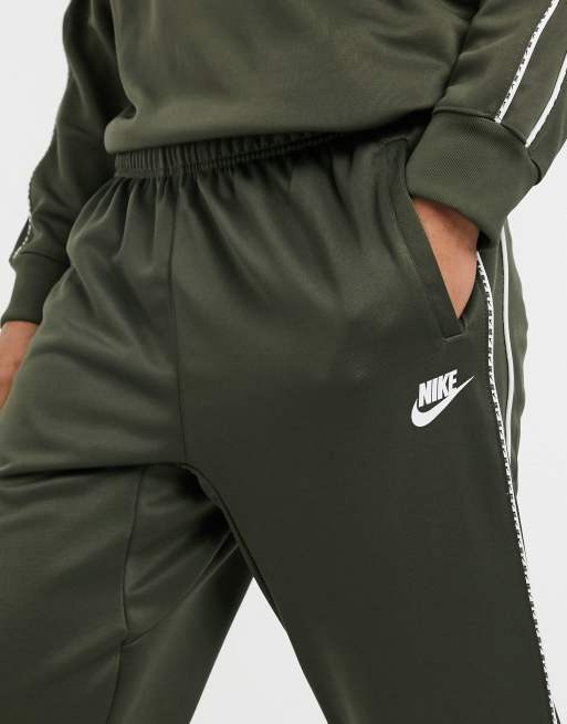 Nike repeat pack polyknit logo taping cuffed joggers in white hot sale