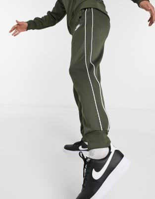 nike repeat pack logo taping cuffed joggers in khaki