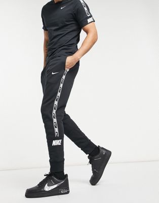 nike logo taping cuffed joggers in black