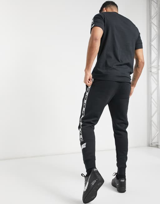 Nike gel tape cuffed track store pants black