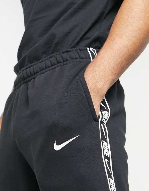 Nike gel tape 2025 cuffed track pants black