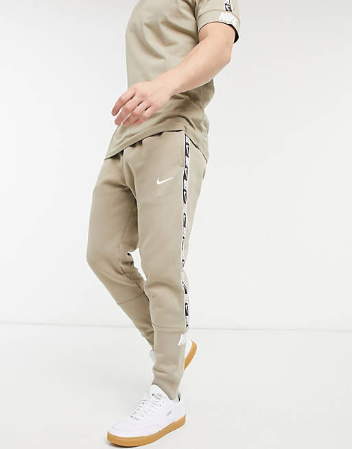 Nike Repeat Pack taping cuffed joggers in stone