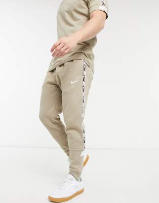 Nike Repeat Pack taping cuffed sweatpants in dusty khaki-Green