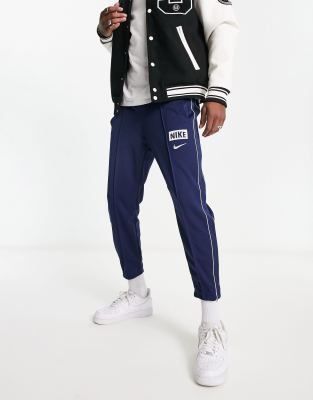 Nike Unisex retro athletics fleece joggers in grey heather and navy