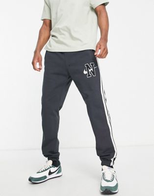 Nike Retro logo fleece loose fit joggers in washed black - ASOS Price Checker