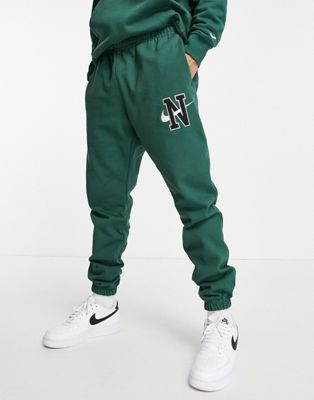 Nike Retro logo heavyweight cuffed joggers in noble green | ASOS