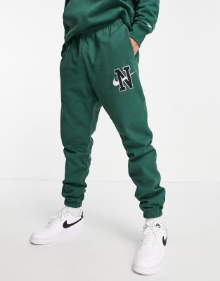 Nike unisex retro collegiate cuffed joggers in sail white