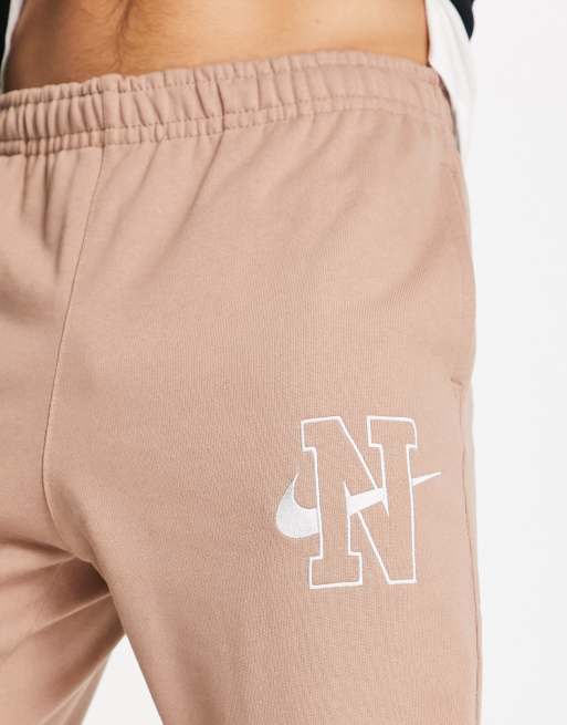 Nike Retro logo loose fit joggers in desert dust