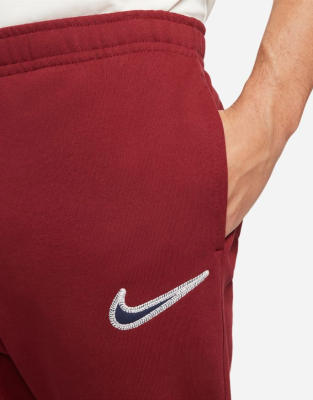 red nike trackies