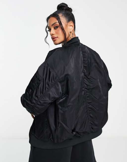 Nike reversible varsity bomber jacket in black | ASOS