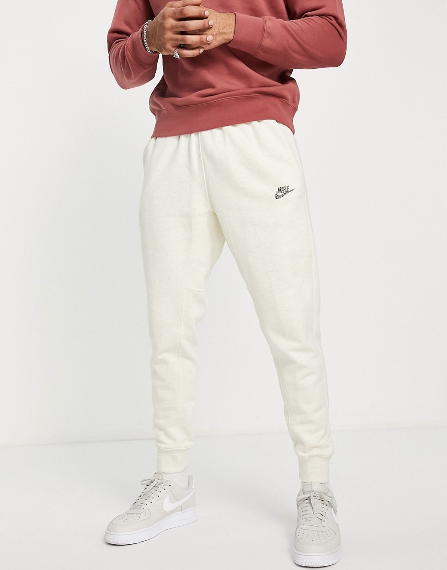 Nike Revival cuffed fleece sweatpants in cream-White