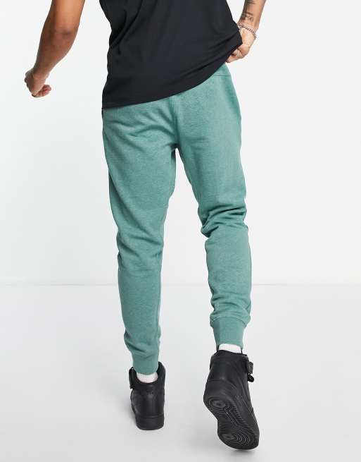 Nike Revival cuffed joggers in teal heather MBLUE