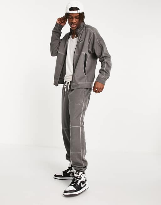 Nike – Revival – Trainingsjacke aus verwaschenem Jersey in Schwarz 