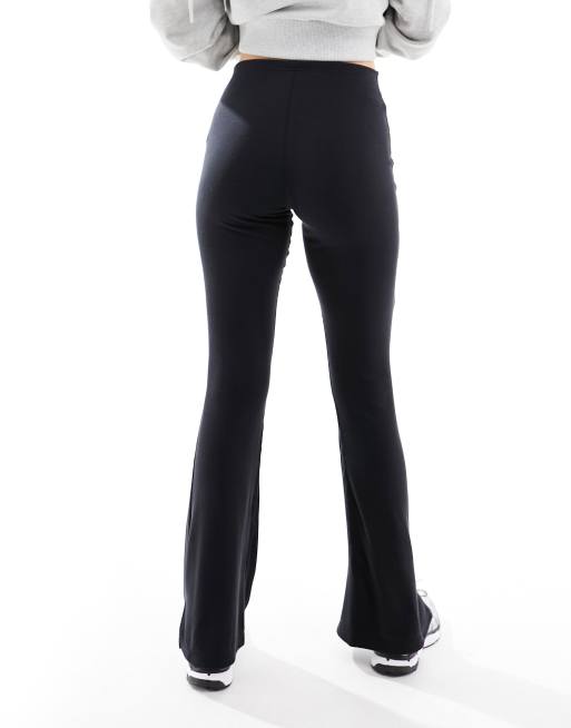 Nike ribbed mid rise flared pants in black | ASOS