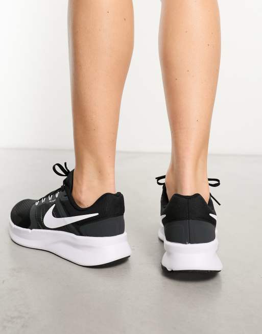 Nike Run Swift 3 sneakers in black and white