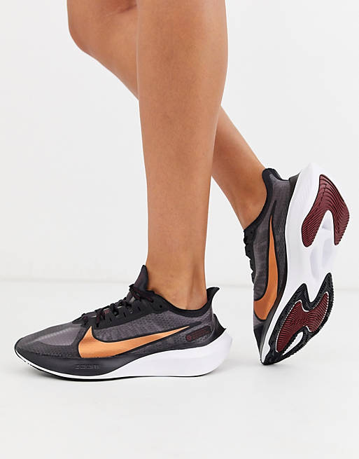 Nike Running air zoom gravity sneakers in black with metallic swoosh