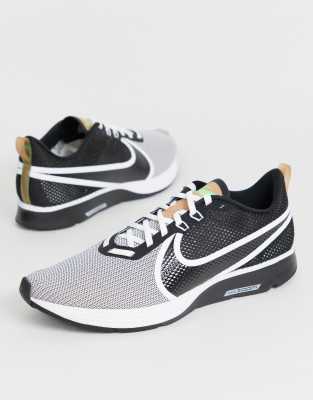 nike running air zoom strike trainers in black