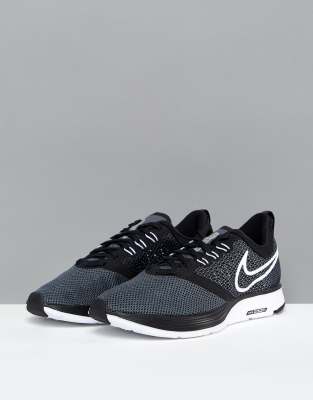 nike running air zoom strike trainers in black