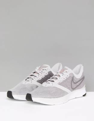 nike running air zoom strike trainers in grey