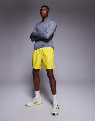 asos Nike Running Challenger Dri-FIT 7 inch shorts in yellow