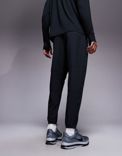 Nike Running Challenger Dri-FIT joggers in black, 4 of 5