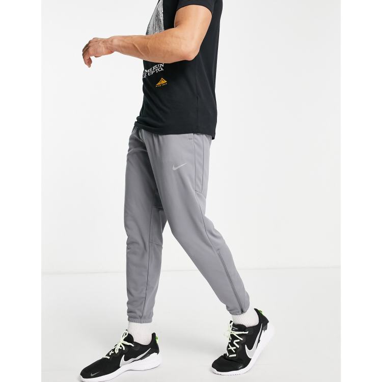 Nike essential woven discount running track pants grey