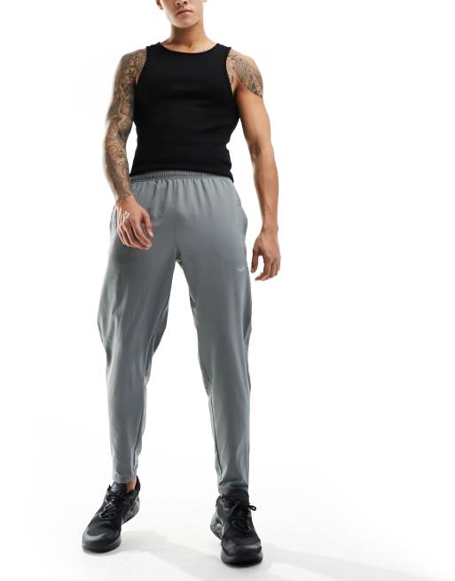 Nike Running Challenger Pantalon de jogging en tissu Dri-FIT