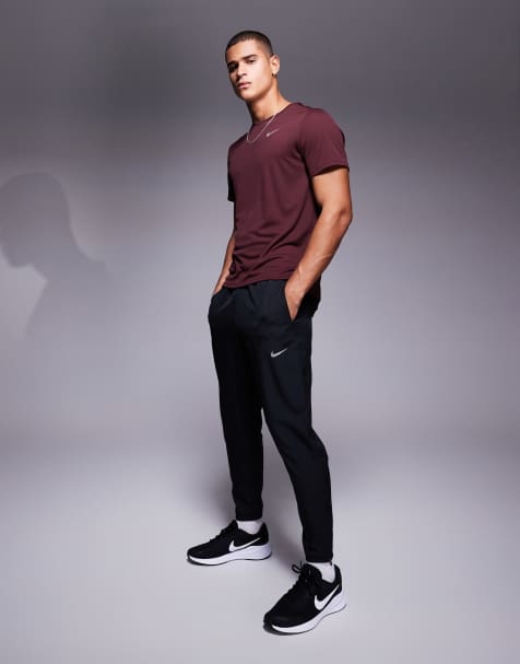 Nike Running Challenger woven joggers in black