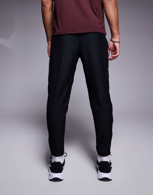 Nike Running Challenger woven sweatpants in black