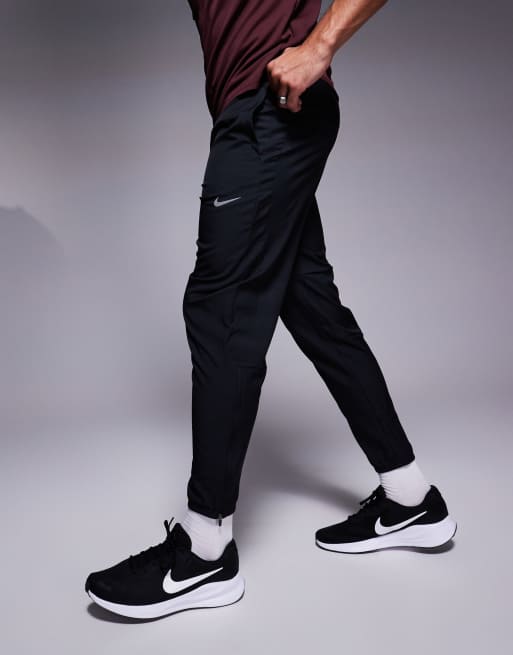 Nike Running Challenger woven sweatpants in black