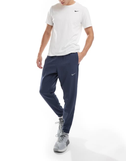 Nike Running Challenger woven sweatpants in dark blue