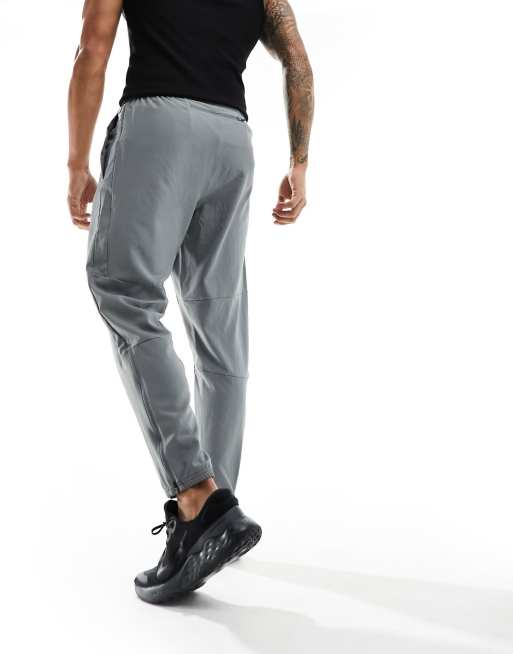 Nike Running Challenger woven sweatpants in gray | ASOS