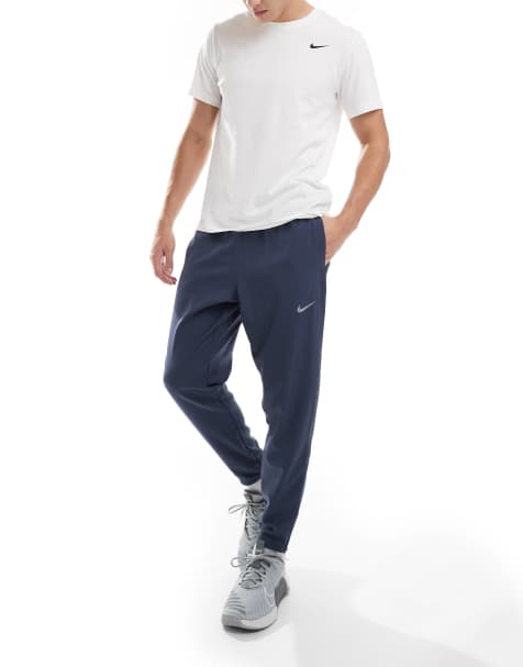 Nike Running Challenger woven sweatpants in navy - view 1
